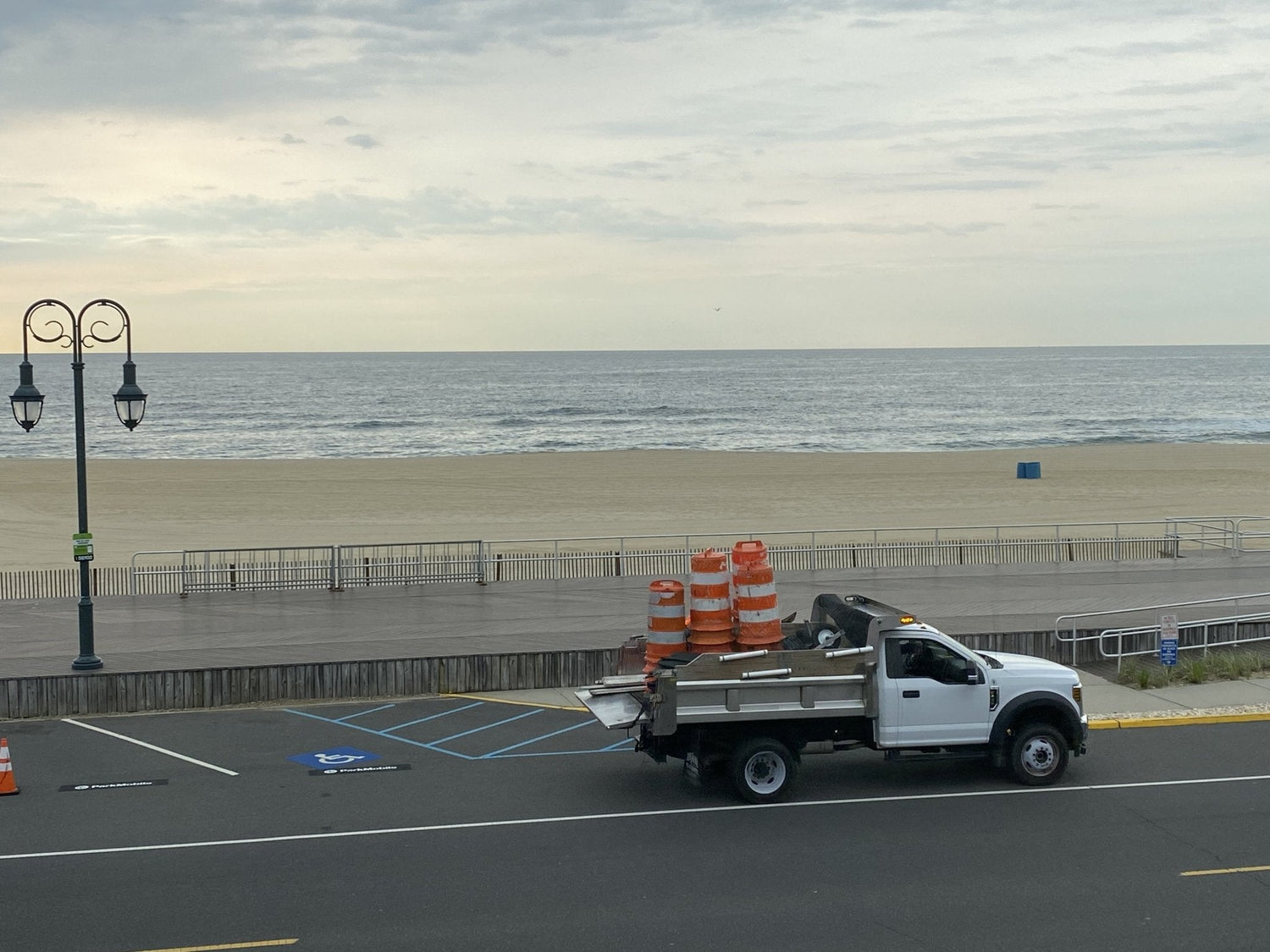 BoardAll the people returning to the beach frontwalking is back benches are gone parking is open